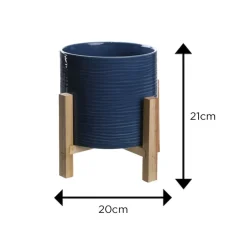 Blue textured ceramic planter on wooden stand (21 x 20 cm)