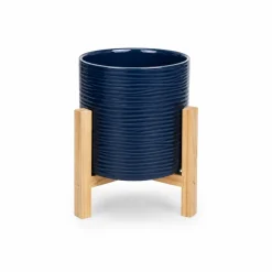Blue textured ceramic planter on wooden stand (21 x 20 cm)