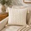 LAURENT TAYLOR - Cable crochet with tassles knit cushion